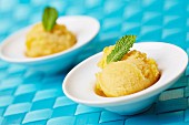 Two scoops of home-made passion fruit sorbet with fresh mint