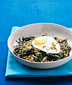 Orzo and spinach hach with fried egg