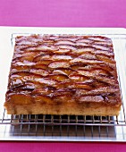 Plum cake on a cooling rack