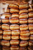 Doughnuts stacked in a shop window