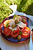 Tomato salad with cheese and green olives