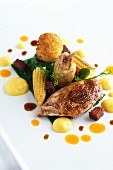 Fried quail with baby sweetcorn, spinach and croquettes