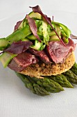 Walnut tart with wild pigeon and asparagus