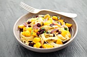 Tagliatelle with pumpkin, cranberries and parsley