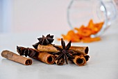 Assorted flavourings for mulled wine (orange peel, star anise, cinnamon sticks)