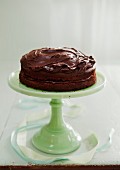 Whole Chocolate Frosted Cake on Cake Stand