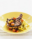 Grilled pork chop with yellow beans and carrots