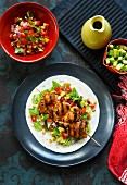 Grilled chicken skewers with salsa and avocado (Mexico)