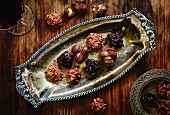 Assorted filled chocolates on an antique tray