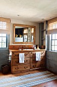 Wooden, vintage-style washstand cabinet with drawers and gilt-framed mirror