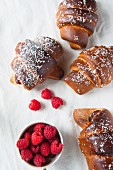 Chocolate croissants with raspberries and coconut