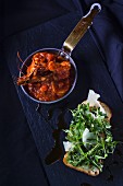 Tomato and shrimps stew with ruccola bread