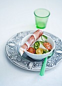 Tomato and cucumber salad with prosciutto