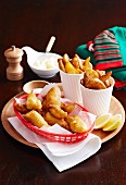 Beer-battered fish with oven-baked potato wedges