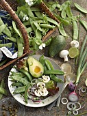 A plate of raw vegetables and sugar snap peas