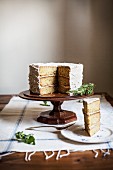 Rosemary Corn Cake with Brown Butter and Honey Buttercream Frosting with a Slice Plated