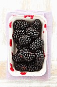 Blackberries in a cardboard container