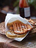 Heart-shaped buttermilk and banana waffles in a white napkin