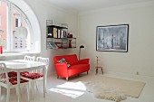 Modern living room with red sofa