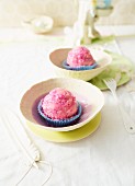 Cake balls with cherry filling and pink glacé icing