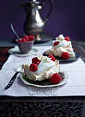 Lime and buttermilk espuma in meringue baskets with raspberries