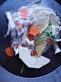 Chicken feet with carrots and celeriac