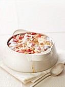 Baked rhubarb and quark dessert with icing sugar