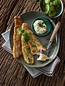 Breaded fillets of European perch with tartare sauce and cucumber salad
