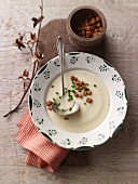 Cheese soup with croutons of rustic bread and chives