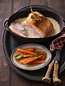 Roast pork in a white sauce with carrots
