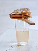 Crispy almond biscuits on top of a drink