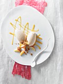 Apricot quark mousse with apricot wedges and amarettini crumbs