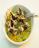 Rollmops with pine nuts in herb oil