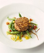 Grilled medallion of beef on green beans