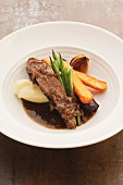 Braised beef brisket with mashed potato and vegetables