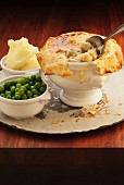Chicken pot pie with peas and mashed potato (England)