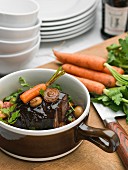 Meal with carrot in rustic pot
