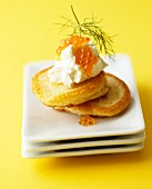 Blinis with sour cream, caviar and dill