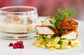 Cured chicken leg and crispy chicken breast with savoy cabbage and apples, cranberries and quark Spätzle (soft egg noodles from Swabia)