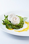 Rolled sole fillets on a bed of coconut & curry spinach with orange auce