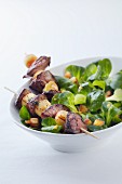 Chicken liver and apple skewer on lamb's lettuce