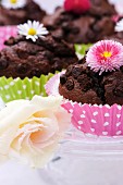 Chocolate muffins decorated with flowers