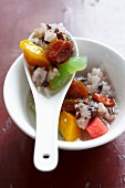 Steamed sticky rice with dried fruits and seeds