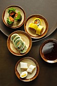 Sticky rice and mango rolls, nori sushi, mango sushi and tofu skin sushi