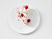 A slice of raspberry cream gateau