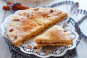 Semolina cake with jam filling and flaked almonds