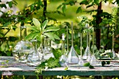 Various glass vases on table outdoors
