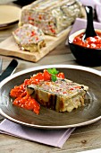 Meatloaf wrapped in aubergine, with tomato sauce