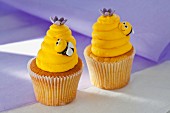 Vanilla cupcakes with lemon buttercream and bees made from fondant icing