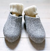 A pair of slippers with woolen socks